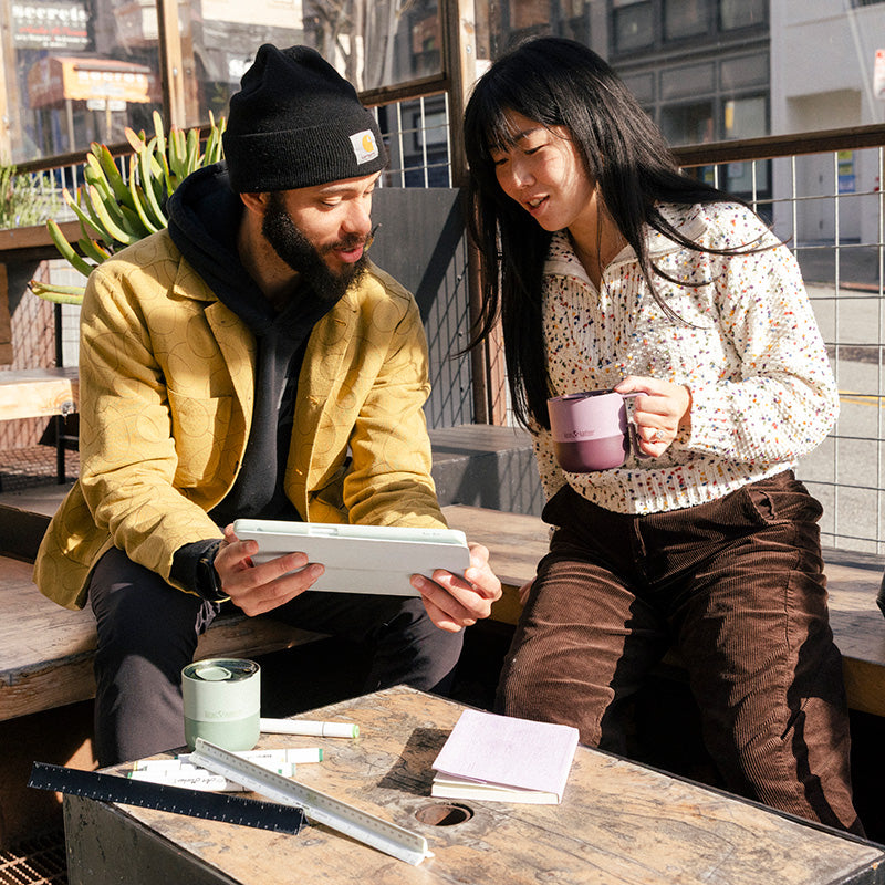 12oz-rise-mug-g8 12oz_rise_coffee_mug_dusty_orchid_couple_city_patio_square.jpg