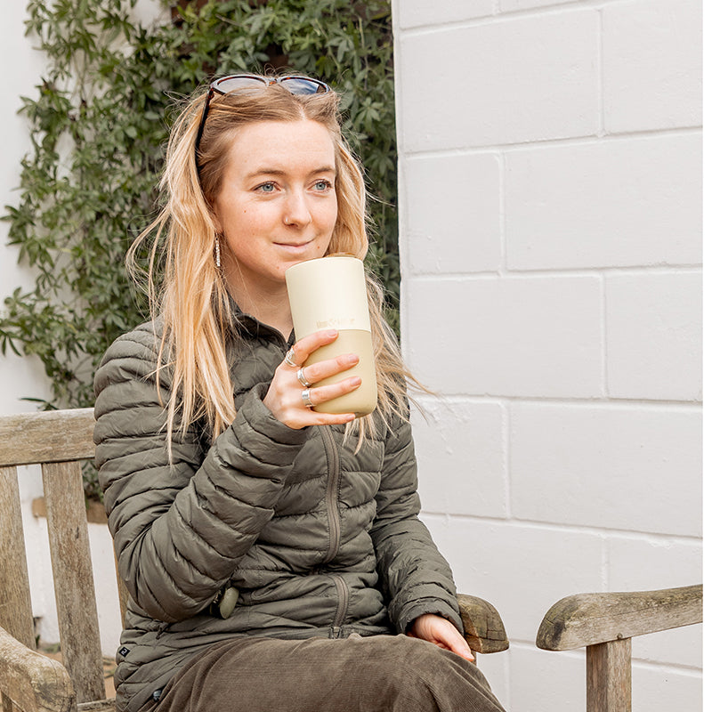 16oz-rise-tumbler-f3 16oz_rise_tumbler_wax_yellow_woman_seat_outside_square.jpg