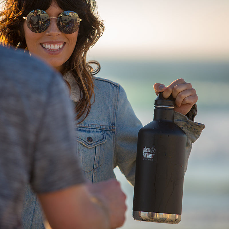 64oz-classic-with-loop-cap-i0 64oz_insulated_classic_black_beach_girl_hand_square.jpg