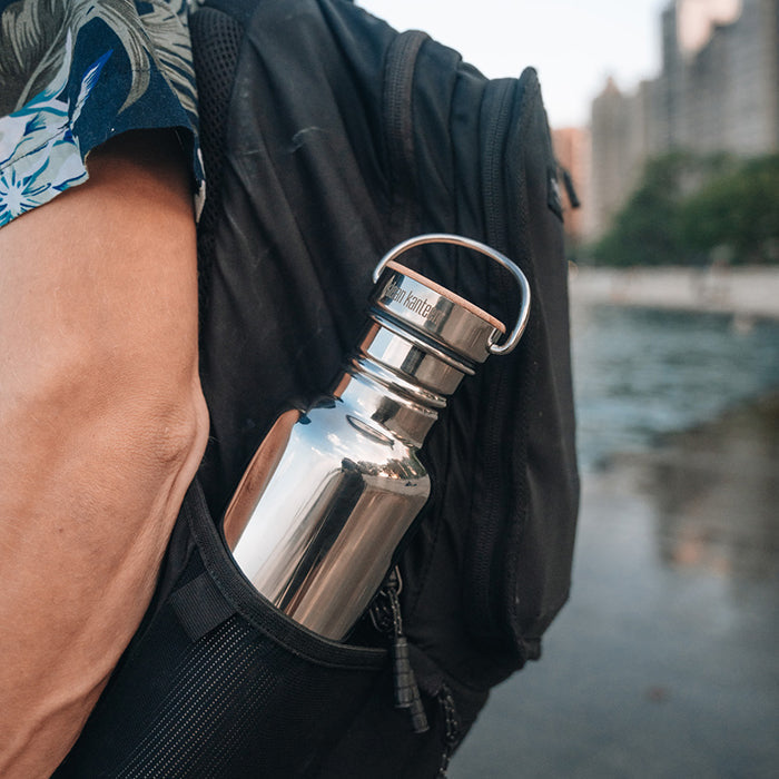 27oz-reflect-with-bamboo-cap-s5 K27SSLRF-MS-BAMBOO_reflect-bottle_backpack_lifestyle.jpg